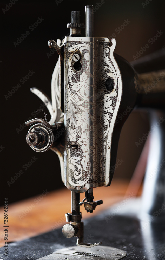 Closeup old sewing machine with lever and guide