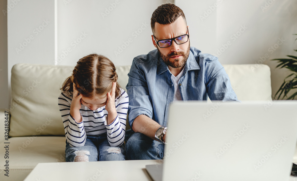 family a businessman father working at a computer and his child daughter  offended angry .