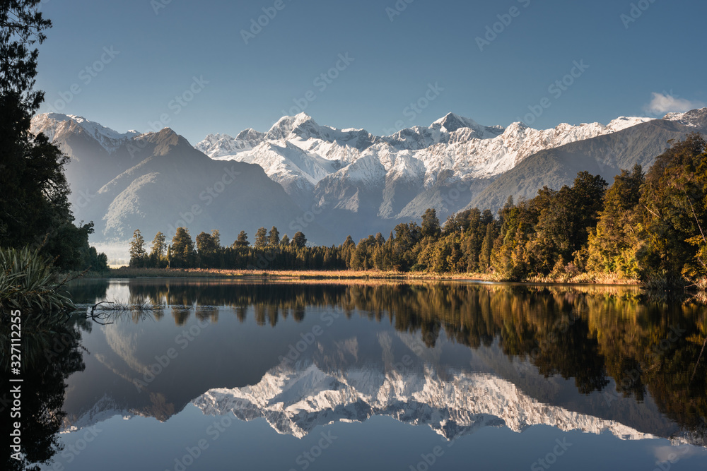 Lake matheson, South Island, New Zealand, with reflection of mount tasman and aoraki mount cook in w
