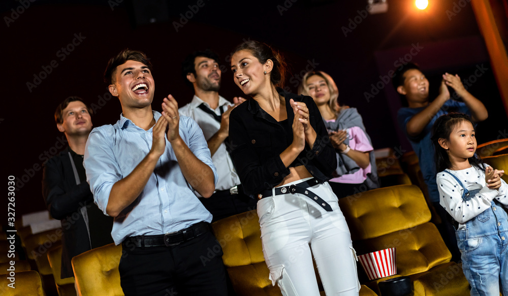 Group of audience happy and fun watch cinema in movie theater. Group recreation activity and enterta