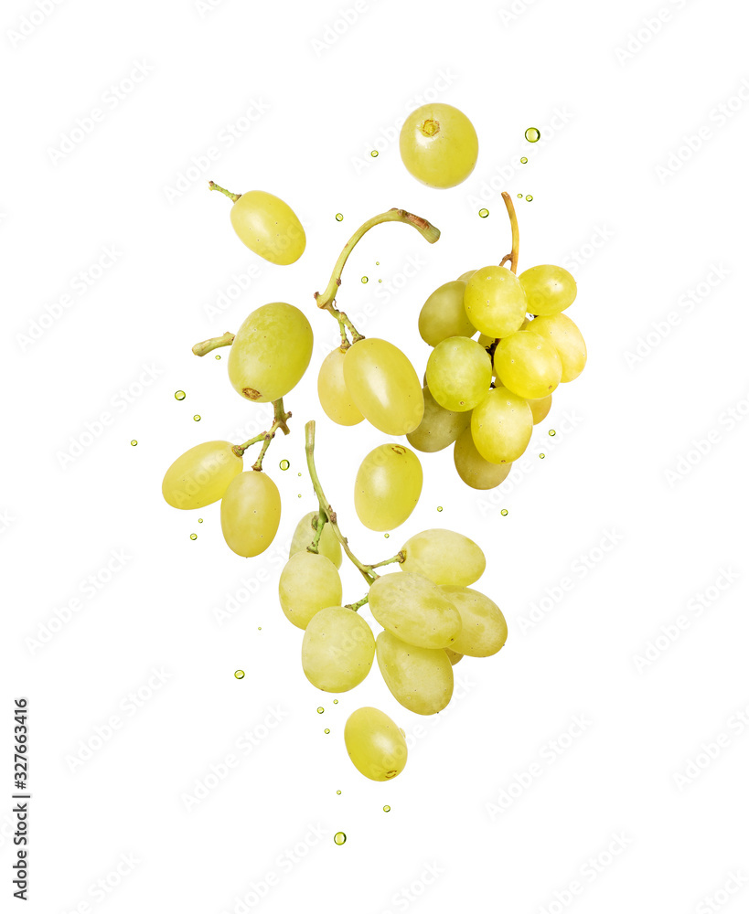 Grape with drops of juice in the air isolated on a white background