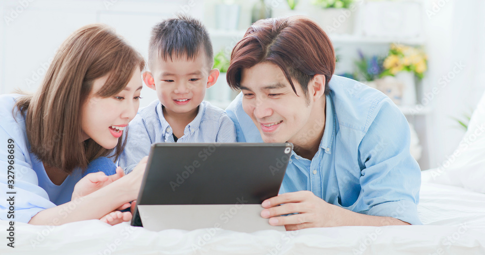 Parent play with child by tablet