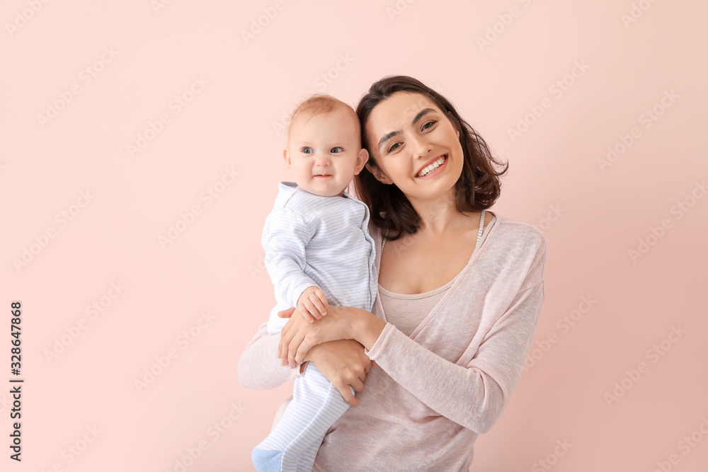 Cute baby with mother on color background