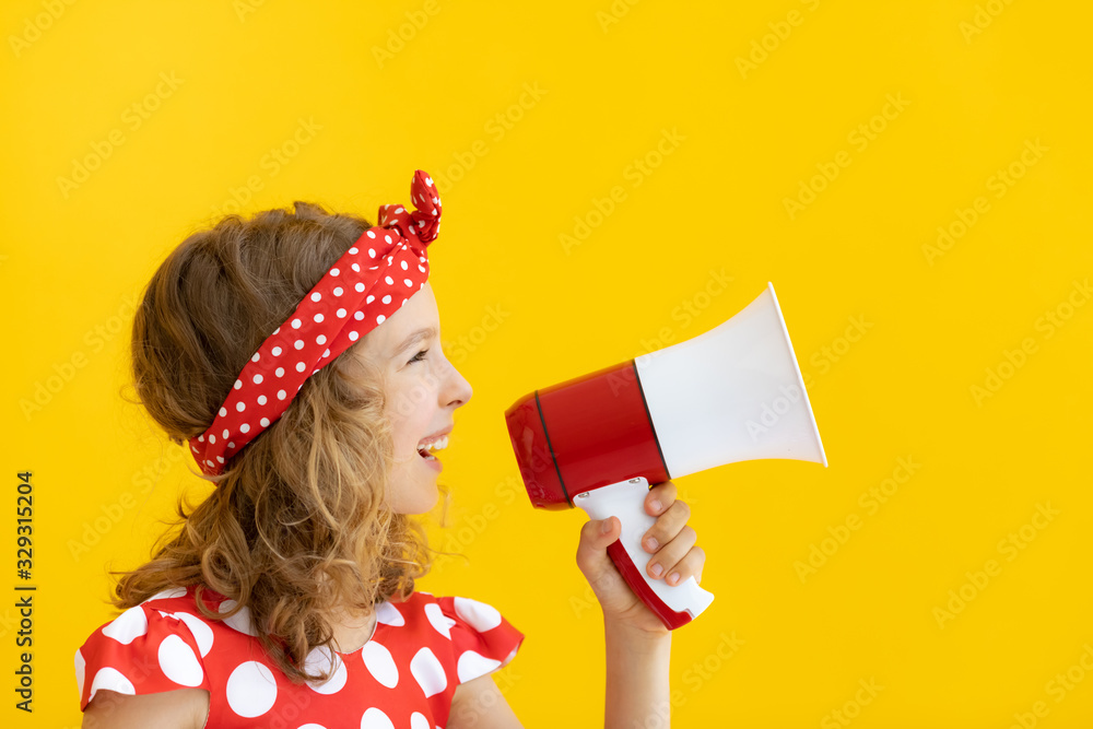 Teenager girl holding red megaphone