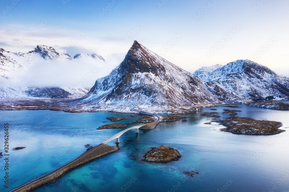 View from the air on the bridge and mountains during sunset. Lofoten Islands, Norway. Landscape from