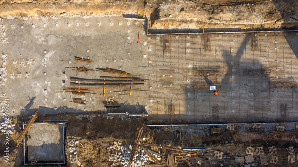 Construction site, equipment and materials, top view.