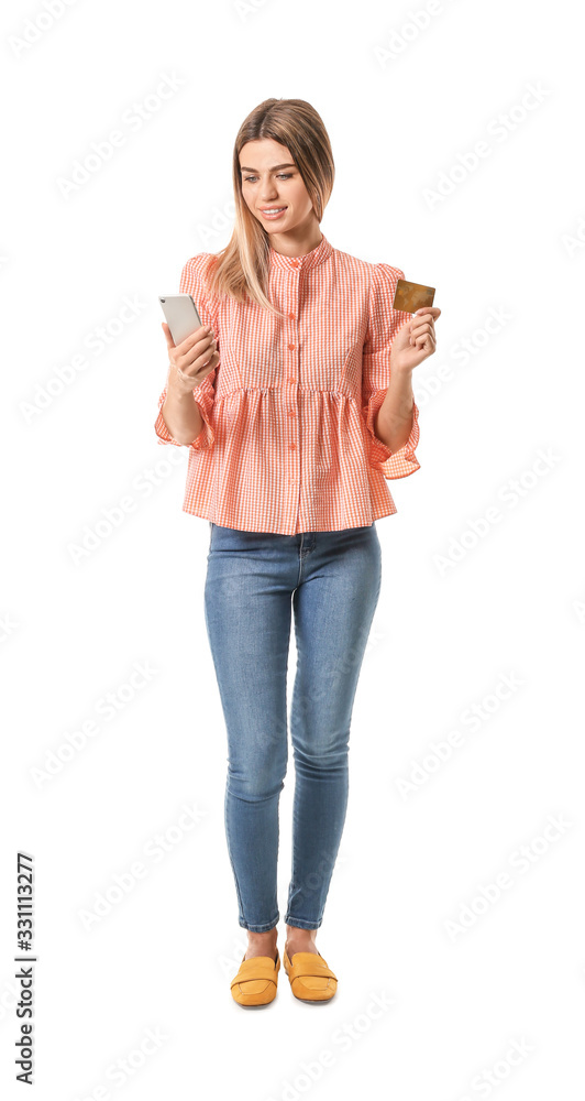 Young woman with mobile phone and credit card on white background. Online shopping concept