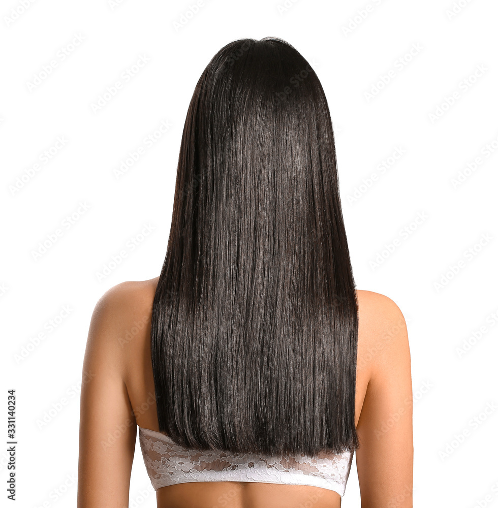 Young Asian woman with beautiful long hair on grey background