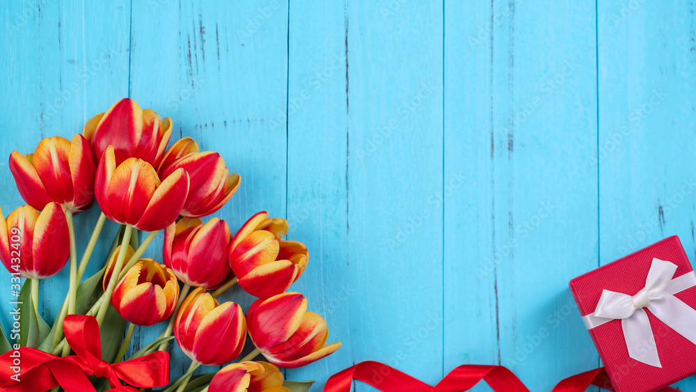 Tulip flower bunch, Mothers Day Design Concept - Beautiful Red, yellow bouquet isolated on blue woo