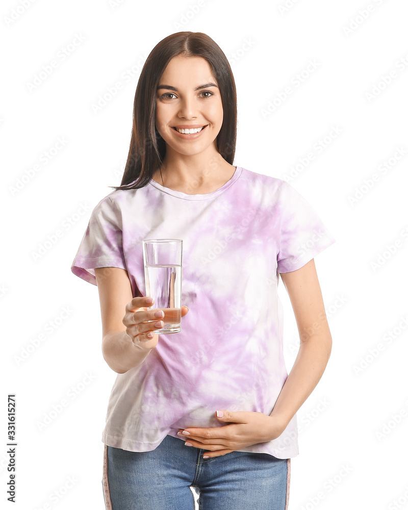 Beautiful pregnant woman with glass of water on white background