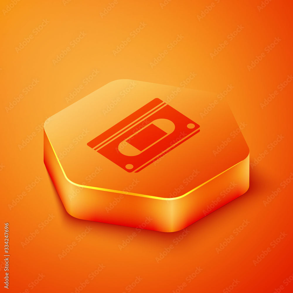 Isometric VHS video cassette tape icon isolated on orange background. Orange hexagon button. Vector 