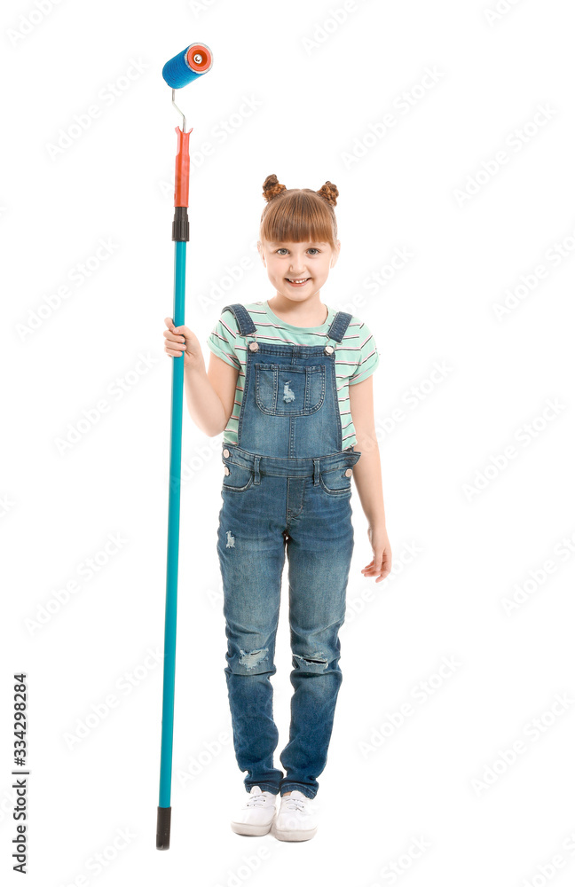 Little girl with paint roller on white background