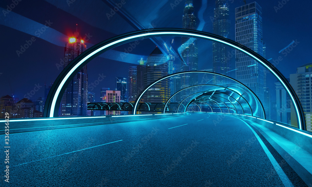 以城市夜景为背景的隧道立交道路的未来主义霓虹灯和玻璃立面设计