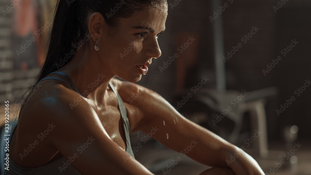 Beautiful Strong Fit Brunette in Sport Top and Shorts in a Loft Industrial Gym with Motivational Pos
