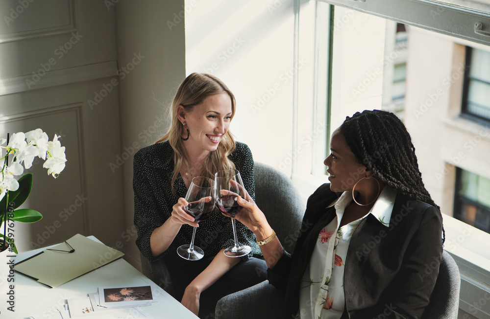 Women celebrating with wine