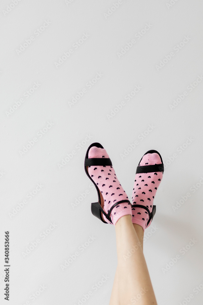 Woman wearing pink hear socks