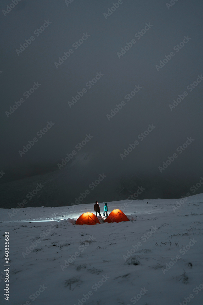 Camping in a tent during winter