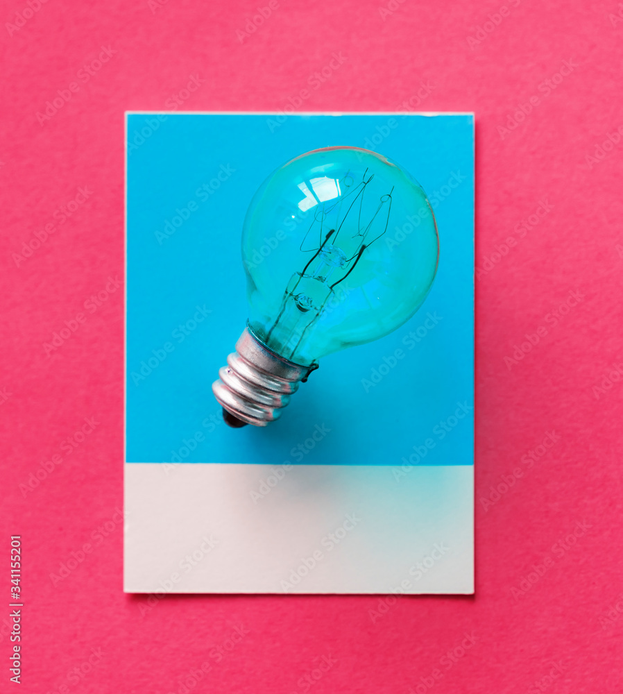 Colorful light bulb on a paper