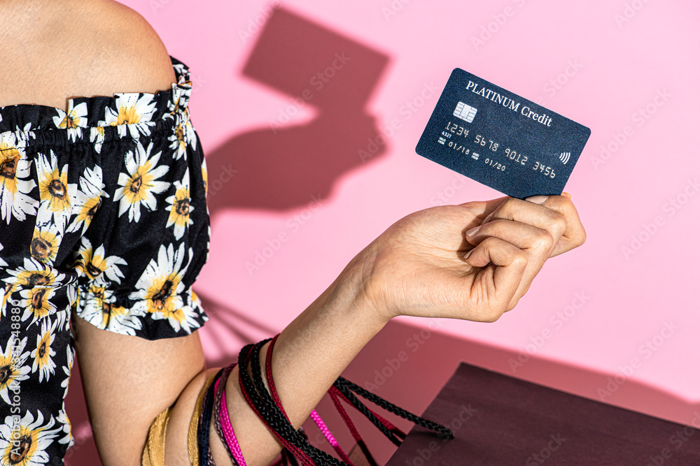 Shopaholic woman with a credit card