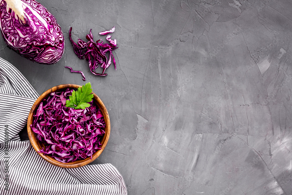 Red cabbage - coleslaw, cold-slaw - on grey kitchen desk top-down space for text