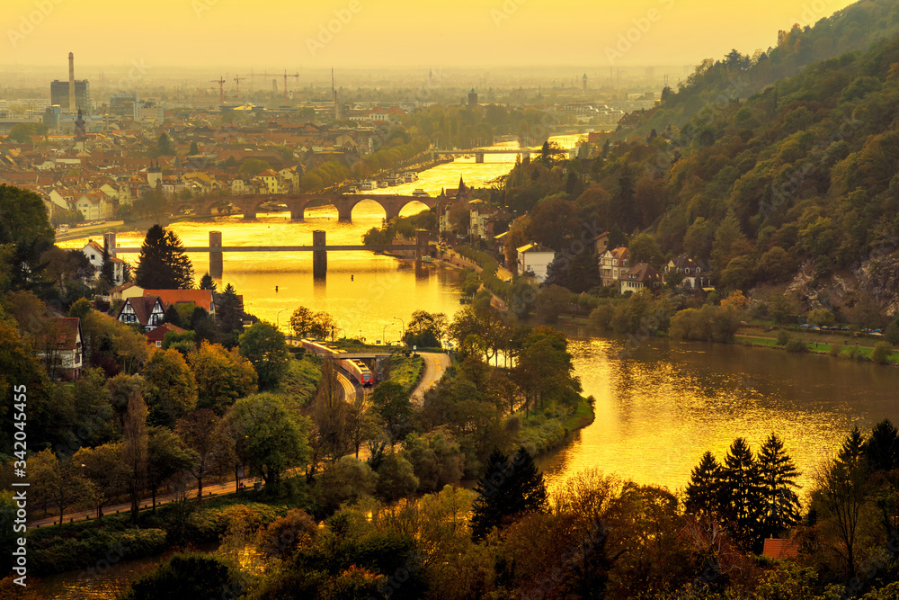 Heidelberg and the Neckar river, Germany, at a gold sunset, shot from above with a yellow filter to 