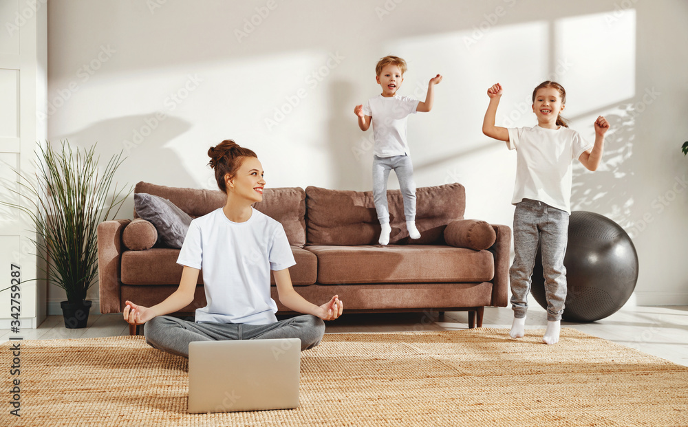 Meditating woman with naughty children at home.