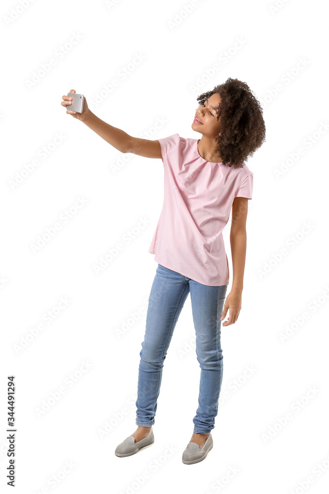 African-American teenage blogger with mobile phone on white background