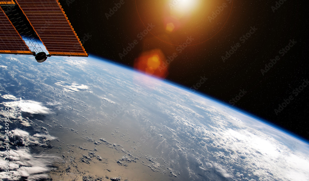 日出期间从空间站窗口观看地球的景象，该图像的3D渲染元素
