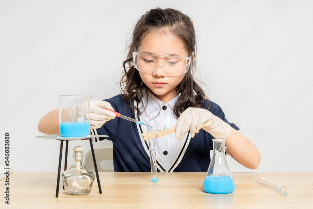Asian primary school girls doing chemical experiments