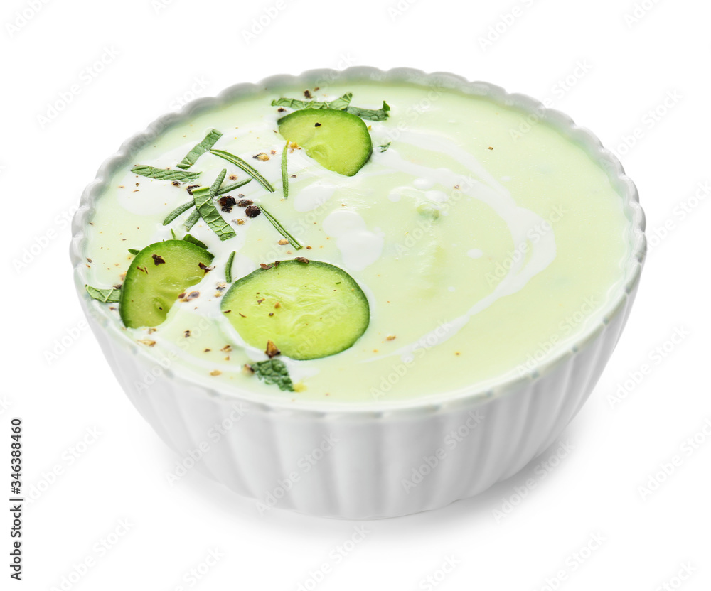 Bowl with cold cucumber soup on white background