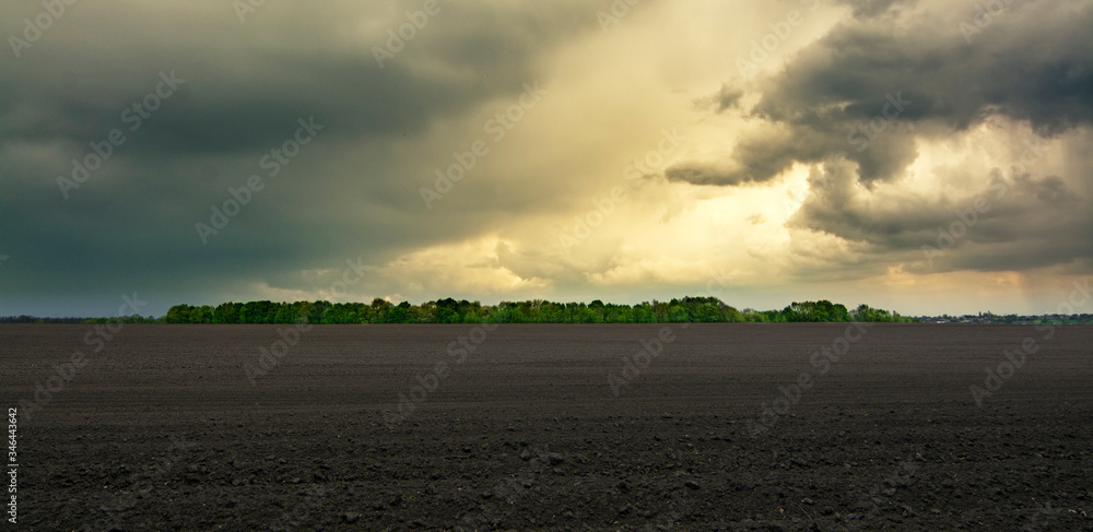 Storm And Rain Above Countryside Rural Field Or Meadow Landscape 