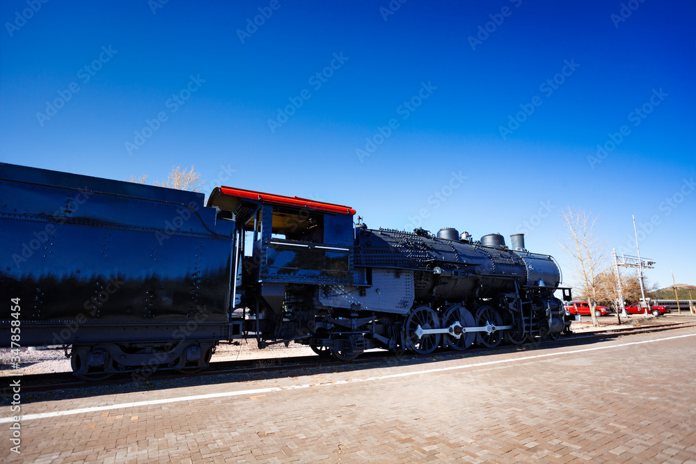 Old steam iron big locomotive on the station in Arizona, USA