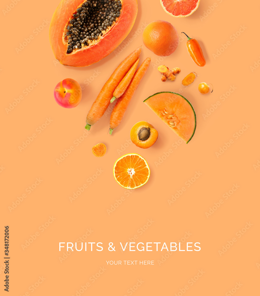 Creative layout made of carrot, papaya, orange, grapefruit, apricot, melon, curcuma, and pepper on t