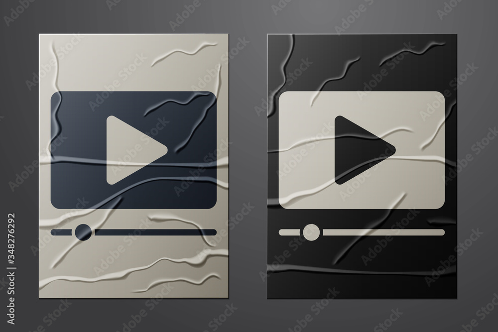 White Online play video icon isolated on crumpled paper background. Film strip with play sign. Paper
