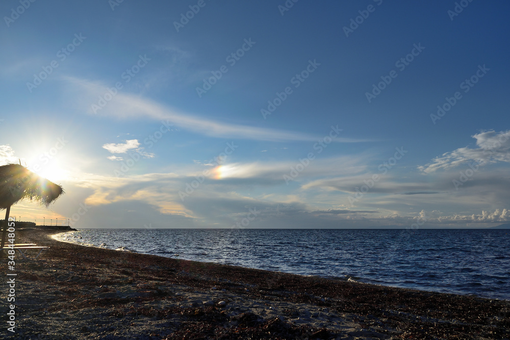 rare optical phenomenon, especially in mid-summer: sun dog (parhelia) produced by the reflection and