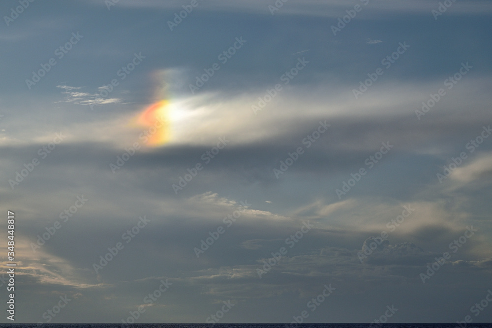 rare optical phenomenon, especially in mid-summer: sun dog (parhelia) produced by the reflection and