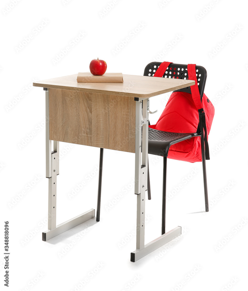 School desk with chair and backpack on white background