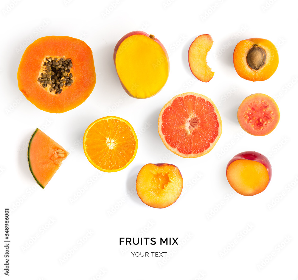 Creative layout made of orange fruits. Flat lay. Food concept. Papaya, apricot, mango, melon, peach,