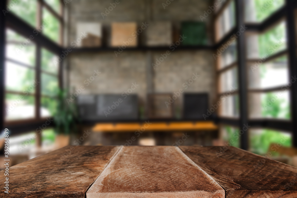 Empty top of wooden shelves on coffee shop ,tree front view background. For product display blur bac