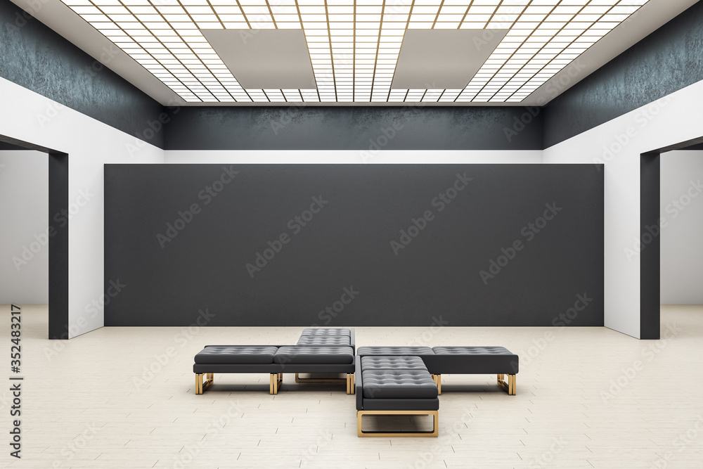 现代画廊大厅内部有空的黑色墙壁和长椅。