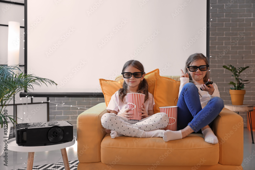 Little girls watching movie at home