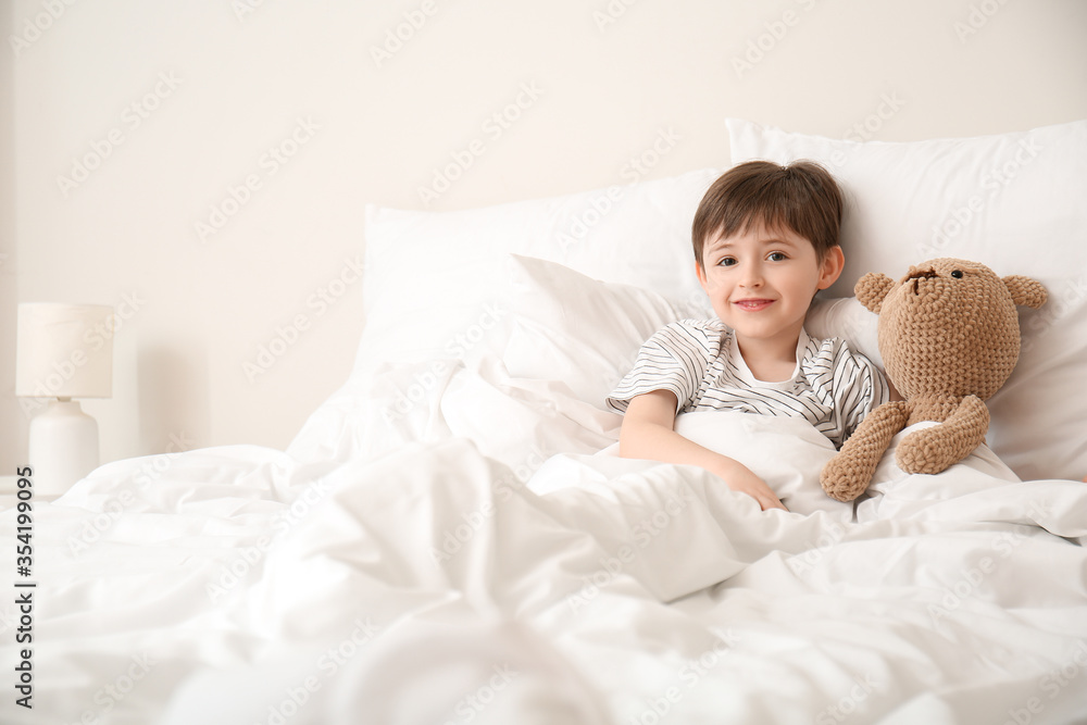 Morning of little boy in bedroom