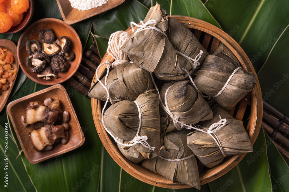Rice dumpling, zongzi - Traditional Chinese food on green leaf background of Dragon Boat Festival, D