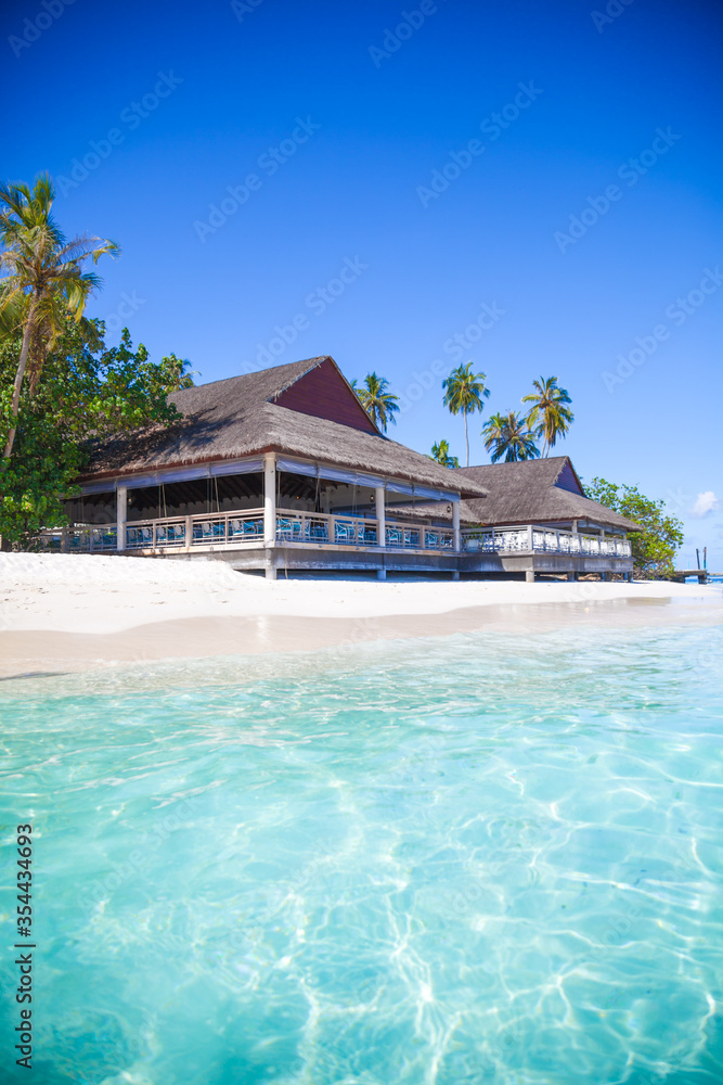 Cafe on a tropical beach. Maldives beach with cafe