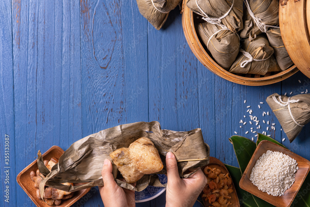 zongzi - Dragon Boat Festival concept Rice dumpling, traditional Chinese food on blue wooden backgro