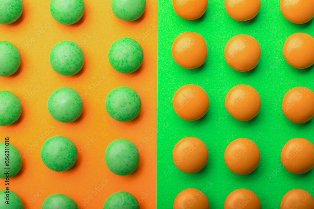 Sweet candies on color background