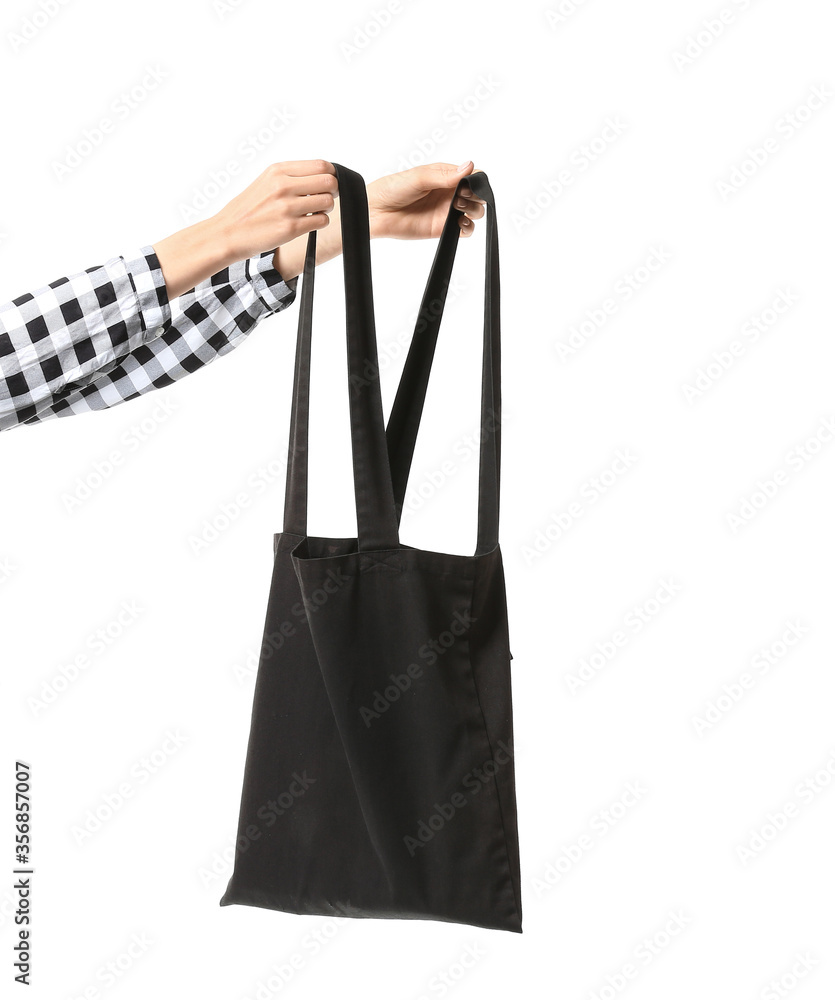 Female hands with eco bag on white background