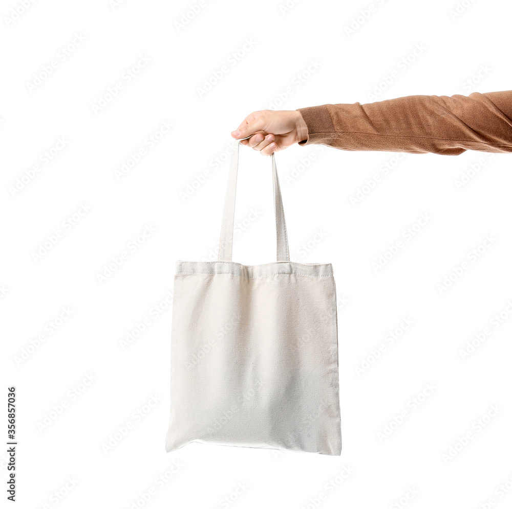 Male hand with eco bag on white background