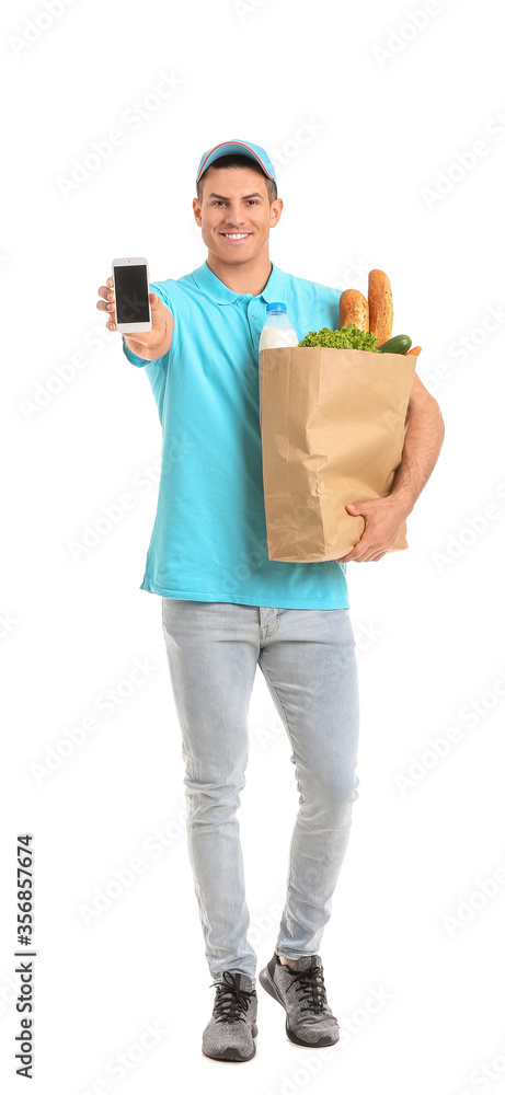 Delivery man with food in bag and mobile phone on white background