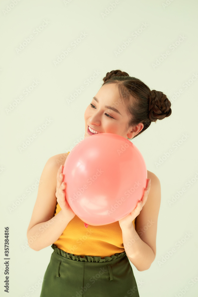 Portrait of nice cute lovable adorable attractive lovely cheerful cheery positive girl holding air b
